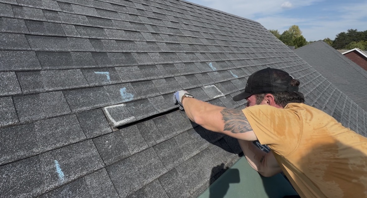 Technician inspecting roof